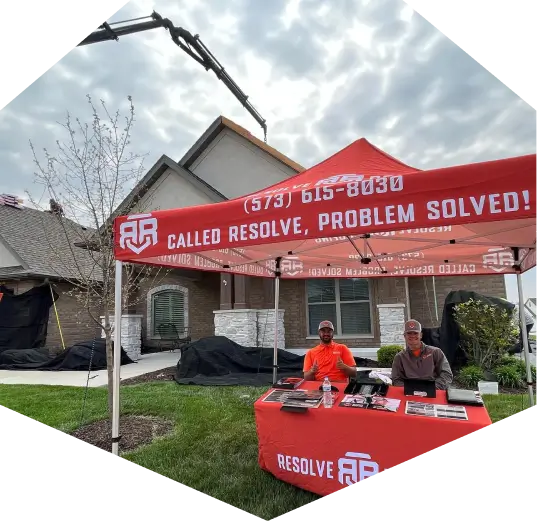 the Resolve Roofing Contractor Team in the "problem solved" tent