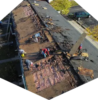 A roof repair company at work on a roof