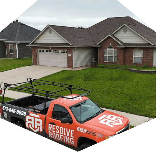 House with roofing truck parked outside during the homeowners residential roofing services