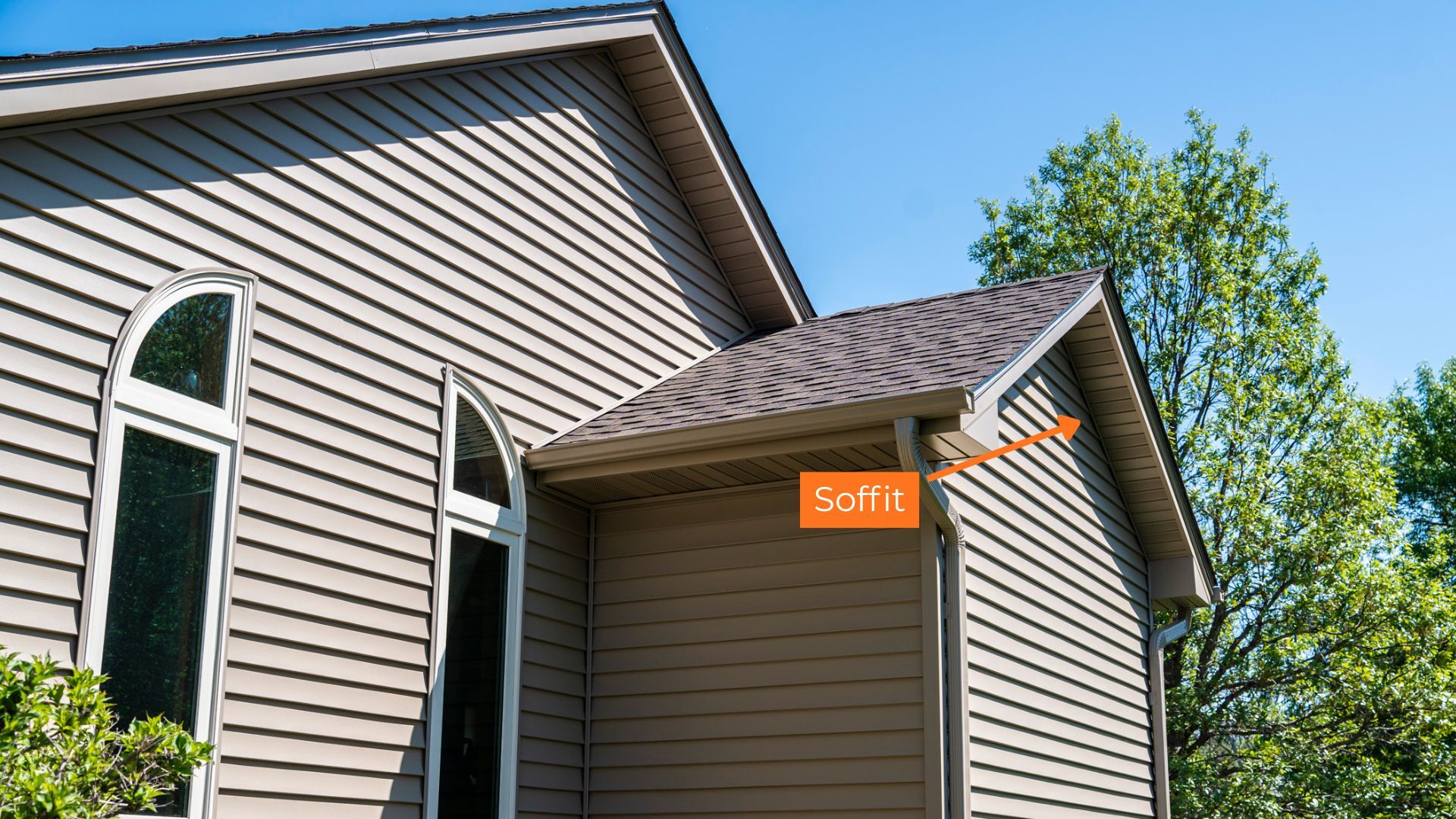 An image with an arrow pointing to a soffit in response to the question "What are soffits?"